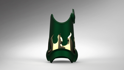 A dark green 3D-printed protective guard or stand with a gold flame-shaped cutout detail, shown on a neutral gray gradient background.
