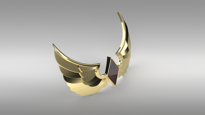 A gold winged crescent moon pendant with a central dark red triangular gemstone, shown on a neutral gray gradient background.