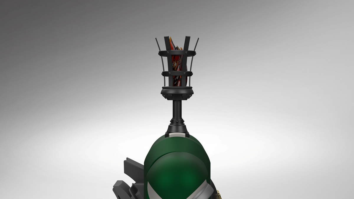 A close-up studio shot of a futuristic green and black mechanical device or prop, featuring a large glossy green dome, angular black supports, and a black cage-like top structure with visible orange and red internal elements, set against a smooth gray gradient background.