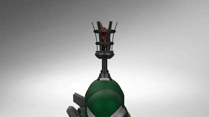 A close-up studio shot of a futuristic green and black mechanical device or prop, featuring a large glossy green dome, angular black supports, and a black cage-like top structure with visible orange and red internal elements, set against a smooth gray gradient background.