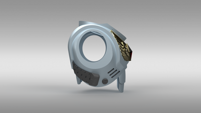 A 3D-rendered futuristic circular ring accessory with a light blue-gray body, dark gray side panels, and a gold wing-like side detail, shown on a neutral gray gradient background.