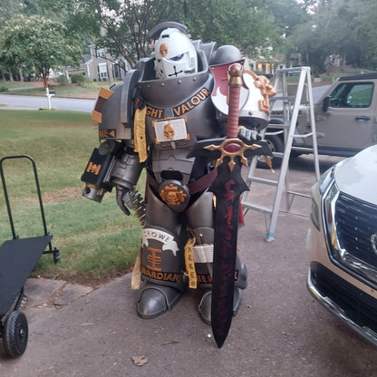 A printed model of a suit of armor designated as Silver Squires Warden armor, displayed outdoors.