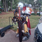 A printed model of a suit of armor designated as Silver Squires Warden armor, displayed outdoors.