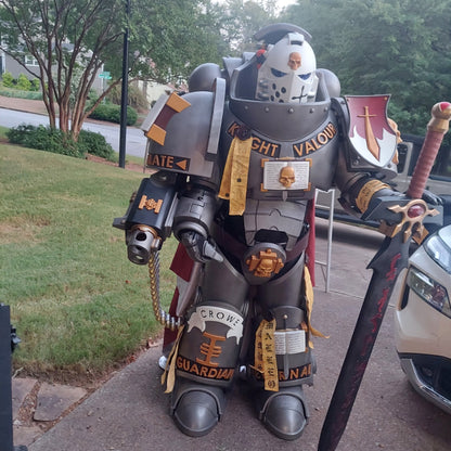 A printed model of a suit of armor designated as Silver Squires Warden armor, displayed outdoors.