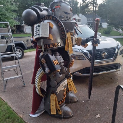 A printed model of a suit of armor designated as Silver Squires Warden armor, displayed outdoors.