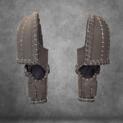 Two identical, futuristic dark gray armored helmets with large visors and white stitching details—perfect for Galactic Warriors cosplay—are displayed side by side against a textured gray background. The V.10 Tactical Arms Pattern is ideal as a digital download EVA foam template for your next costume project.