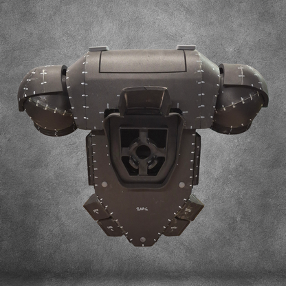 A futuristic, dark metallic tactical backpack featuring riveted panel details and rounded contours, displayed against a textured gray background; inspired by the Galactic Warriors Tactical Remaster and designed with advanced EVA foam crafting techniques—this is the V.10 Tactical Backpack Pattern.