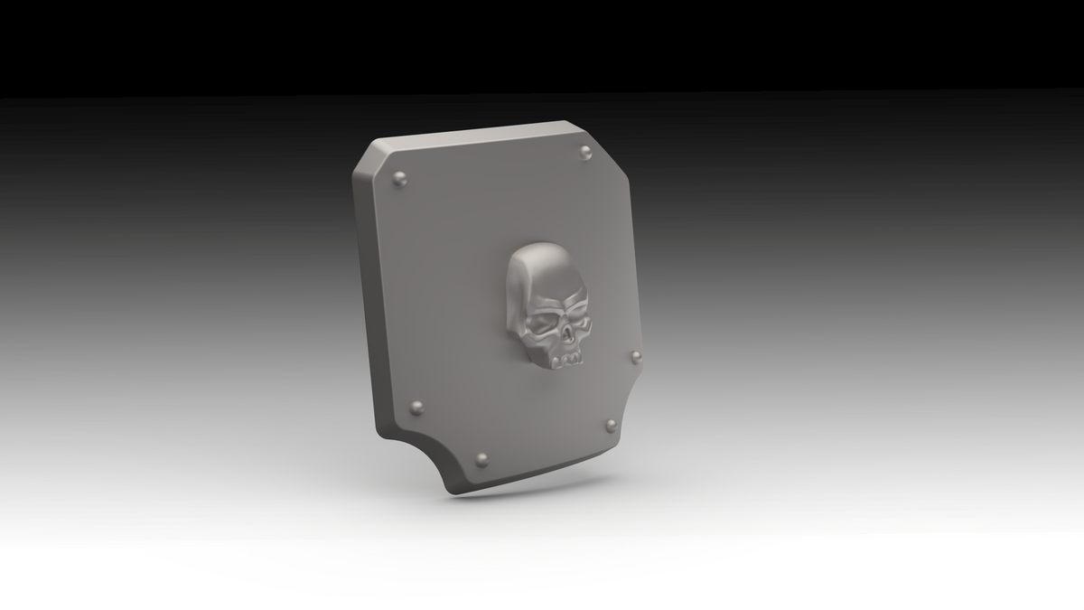 A gray 3D-printed shield-shaped plate with a raised skull emblem in the center and four small screw details around the border, shown on a black-to-white gradient background.