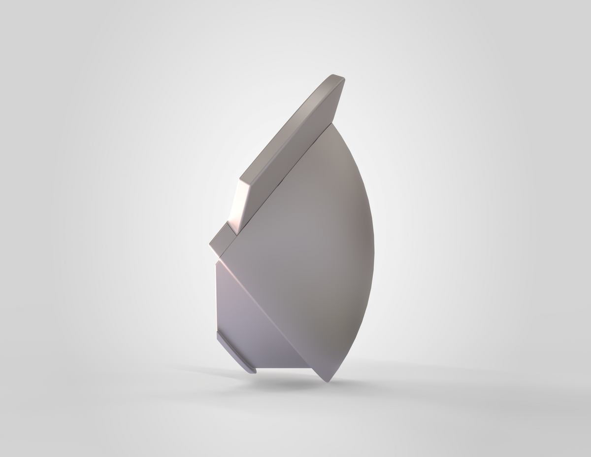 A smooth, abstract metallic object with curved and flat surfaces stands upright on a light gray background, casting a faint shadow—its sleek form reminiscent of the V.10 3D Printed Knee V1.0 as seen in 3D print design files.