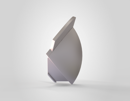 A smooth, abstract metallic object with curved and flat surfaces stands upright on a light gray background, casting a faint shadow—its sleek form reminiscent of the V.10 3D Printed Knee V1.0 as seen in 3D print design files.