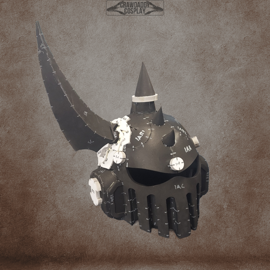 The Mortis Sentry Helmet is a black, spiked fantasy helmet with white accents and intricate mechanical details set against a textured brown background. Inspired by the Mortis Sentry Disease Warrior Helmet, this striking design boasts a prominent horn on one side and metal faceplates with vertical slits. Ideal for cosplay creators, this digital download provides an EVA foam helmet template so you can craft your own impressive headgear.