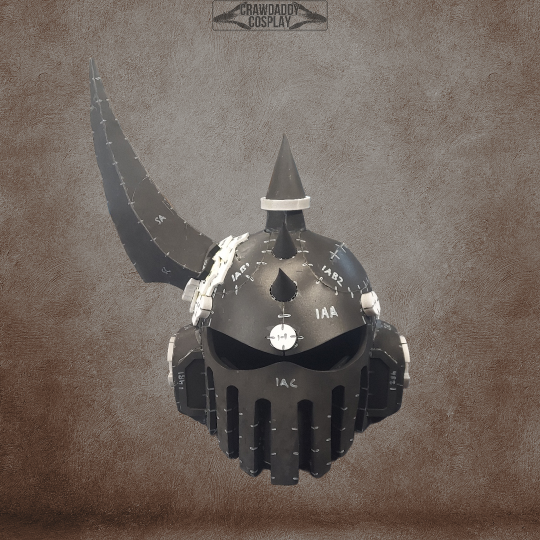 A black, spiked medieval-style helmet with white markings and a single curved horn, inspired by the Mortis Sentry Helmet, is shown against a textured brown background with the Crawdad Cosplay logo at the top. This design is available as a digital download template for EVA foam construction.