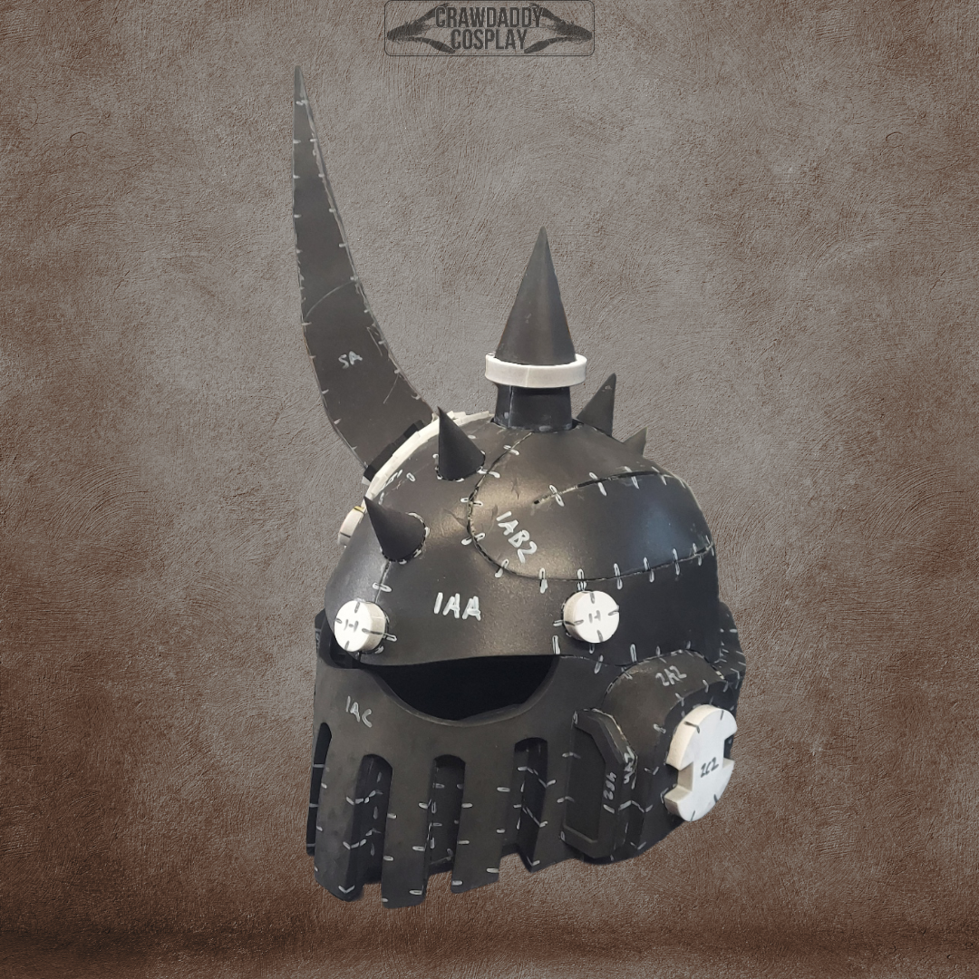 A Mortis Sentry Helmet in black with spiked accents, white markings, rivets, and a barred faceplate featuring gear-like details is shown against a brown textured background—ideal as an EVA foam helmet template for your next cosplay digital download.