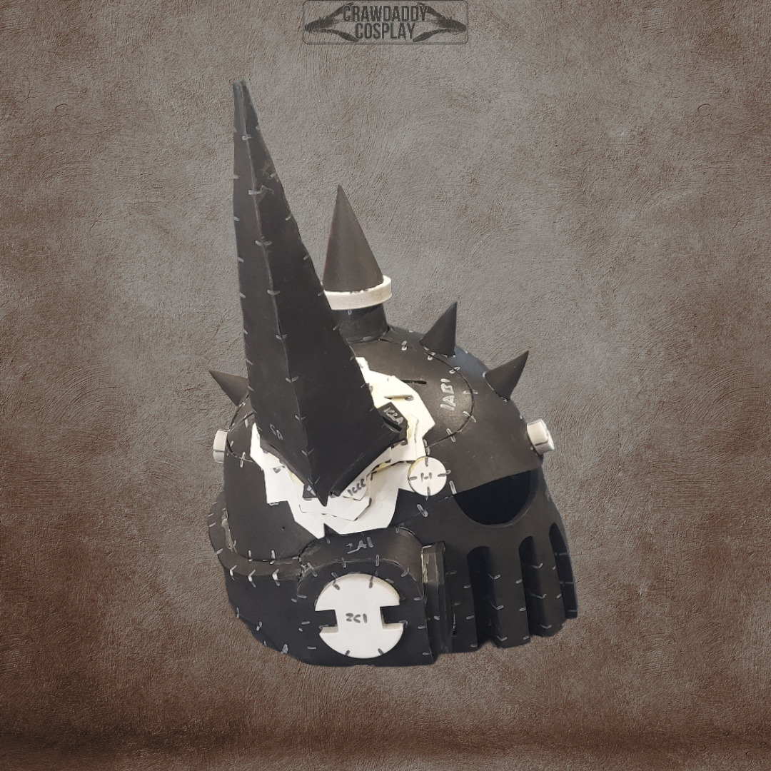 A Mortis Sentry Helmet cosplay piece in black with large spikes and white patch-like details rests on a textured brown background. Crafted using an EVA foam helmet template, this helmet features a prominent central horn and rounded shapes, with “Crawdad Cosplay” written at the top.