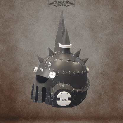 The Mortis Sentry Helmet, featuring a black, spiked, and riveted fantasy or sci-fi-inspired design with a grated mouthpiece and detailed metal accents—ideal for cosplay enthusiasts—is displayed against a textured brown background. Offered as an EVA foam helmet template digital download.