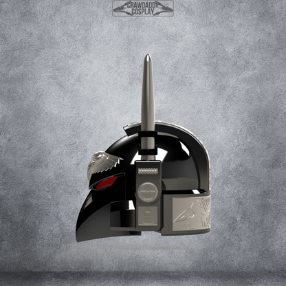 Behold the V.7 Eagle - Sable Sentry Helmet (3D Print | Files Only): a black and silver futuristic helmet featuring a single upright antenna, striking red eye details, and ornate engravings, displayed against a textured gray background. This impressive piece is available as digital download 3D print files—perfect for your collection or cosplay projects.