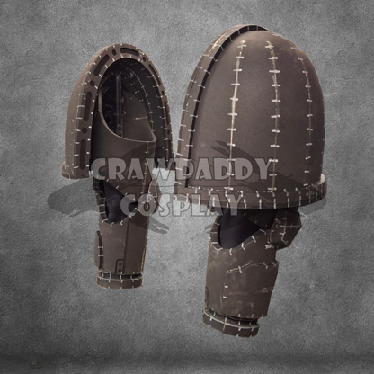 Two views of a brown helmet with intricate detailing on a gray background, branded 'Crawpaddy Cosplay'.
