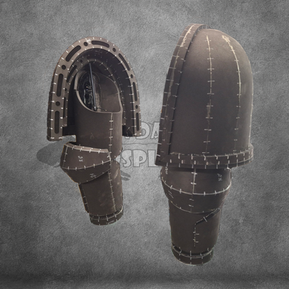 Pair of brown leather boots with stitching details on a gray background