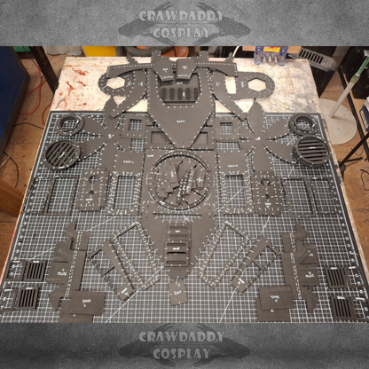 Cosplay costume pieces laid out on a cutting mat with 'Crawdaddy Cosplay' branding.