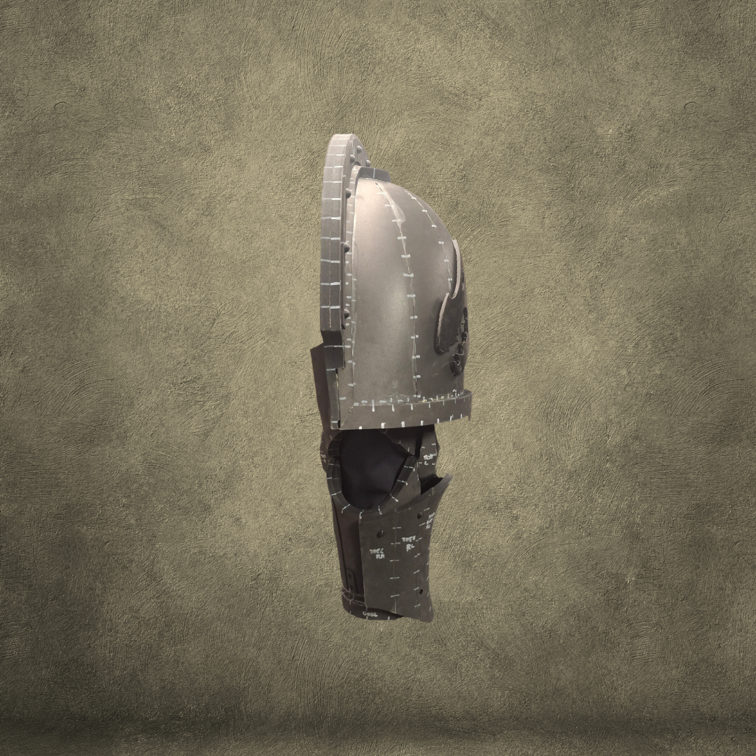 The V.10 Edge Warden Arms Pattern, featuring a segmented medieval-style metallic design ideal as an EVA foam template for crafting, is displayed in profile view against a textured beige background.