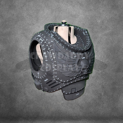 Black and gray armor piece on a mannequin against a gray background