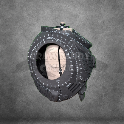 Black and gray circular device with a textured surface on a gray background
