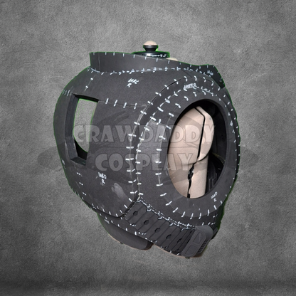Black and gray object with measurements on a gray background