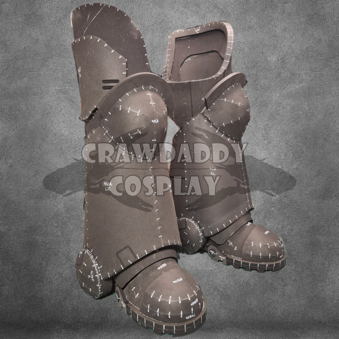 A set of digital templates for creating a costume leg piece, with stitching and detailing, on a grey background with the watermark 'CRAWDADDY COSPLAY'.