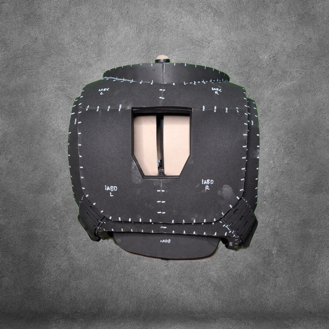 Presenting the V.10 Tactical Chest Pattern: a black protective vest with white stitching and labeled sections, inspired by the iconic Galactic Warriors chest design and displayed against a gray textured background. Ideal for cosplay or crafting projects, this digital download provides you with an EVA foam template, making it simple to recreate detailed armor at home.