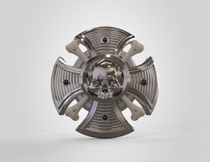 Metallic decorative object with skull design on a white background
