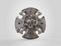 Metallic decorative object with skull design on a white background