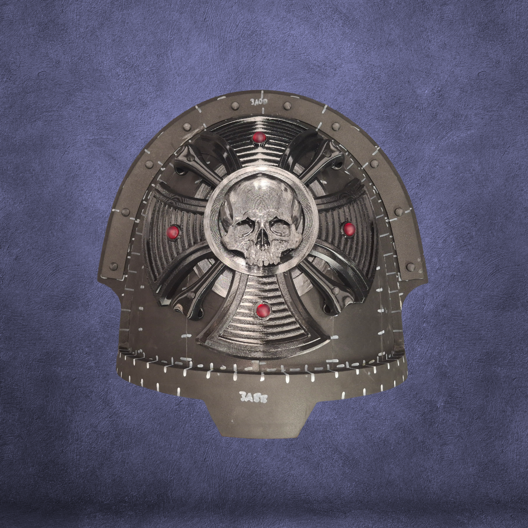 A black, sci-fi helmet dome with a central silver skull emblem, red circular accents, and intricate mechanical design incorporates the V.10 Cross of the End Shoulder Detail (3D Print | Files Only), inspired by 3D-printable Galactic Warriors, all set against a textured purple background.
