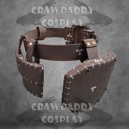 Brown leather bracer with gold accents on a gray background, branded 'Crawdaddy Cosplay'.