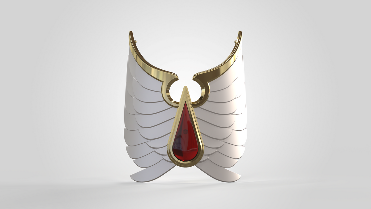A golden winged brooch with white feathers and a large red gem in the center is displayed on a plain light background, showcasing subtle shin detail patterns inspired by the V.10 Crimson Celestials V.1 Shin Detail (3D Print | Files Only) design.