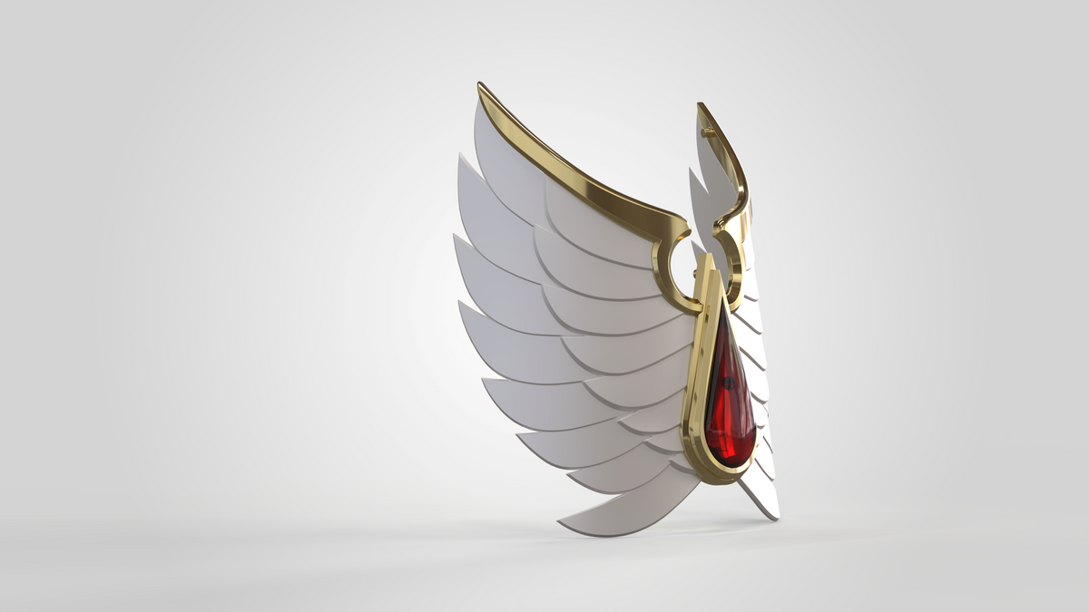 A 3D rendering of stylized white angel wings with gold edging, centered by a prominent red gemstone where the wings converge, and adorned with the distinctive shin detail pattern from the V.10 Crimson Celestials V.1 Shin Detail (3D Print | Files Only), evoking the ornate armor design of Tactical Crimson Celestials from the Galactic Warriors collection. The composition is set against a plain light background.