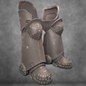 Two unfinished foam armor greaves and sabatons with visible seams, white markings, and stitches—crafted using the V.10 Tactical Legs Pattern for EVA foam—stand upright against a textured gray background. Perfect for cosplay projects, this detailed digital download offers everything needed to create Galactic Warriors-style leg armor.