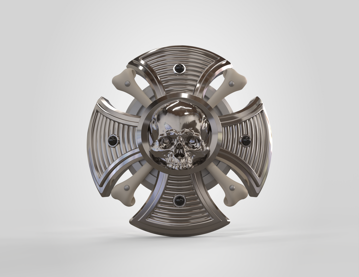 Metallic decorative object with skull design on a white background