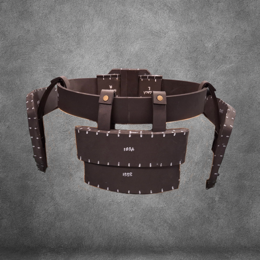 The V.10 Tactical Waist Pattern is a brown leather utility belt design featuring pouches and metallic rivets, inspired by the iconic Galactic Warriors Waist and showcased against a textured gray background. Ideal for cosplay enthusiasts, this digital download includes an EVA foam template for easy crafting.