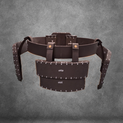 The V.10 Tactical Waist Pattern is a brown leather utility belt design featuring pouches and metallic rivets, inspired by the iconic Galactic Warriors Waist and showcased against a textured gray background. Ideal for cosplay enthusiasts, this digital download includes an EVA foam template for easy crafting.