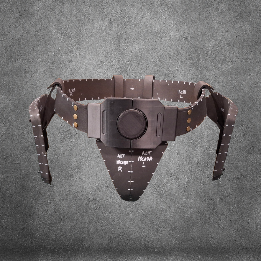 A brown V.10 Tactical Waist Pattern pelvic positioning device with measurement markings and adjustable straps is displayed against a gray textured background; this EVA foam template is available as a digital download.