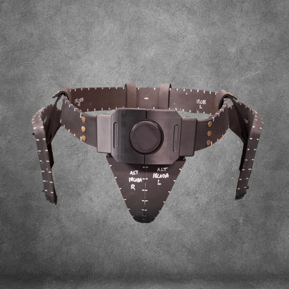 A brown V.10 Tactical Waist Pattern pelvic positioning device with measurement markings and adjustable straps is displayed against a gray textured background; this EVA foam template is available as a digital download.