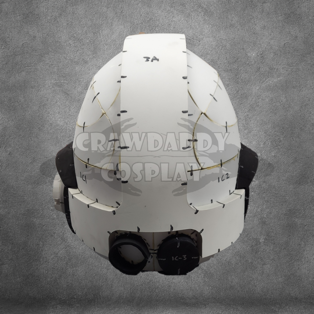 A white, unfinished helmet crafted from EVA foam features visible seams, markings, and two round eye pieces. Displayed against a gray textured background, the words CRAWDADDY COSPLAY appear faintly over the image to highlight this unique Galactic Warriors Universal Beaked Helmet Pattern—an EVA foam helmet template available as a digital download.